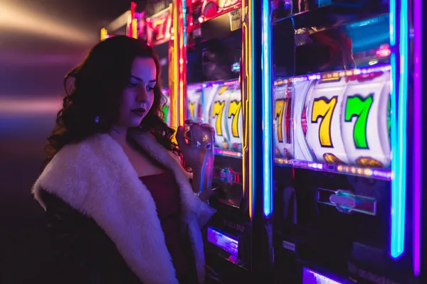 A player using their smartphone during a festive local event, representing 588WINBD’s fully mobile-friendly casino.